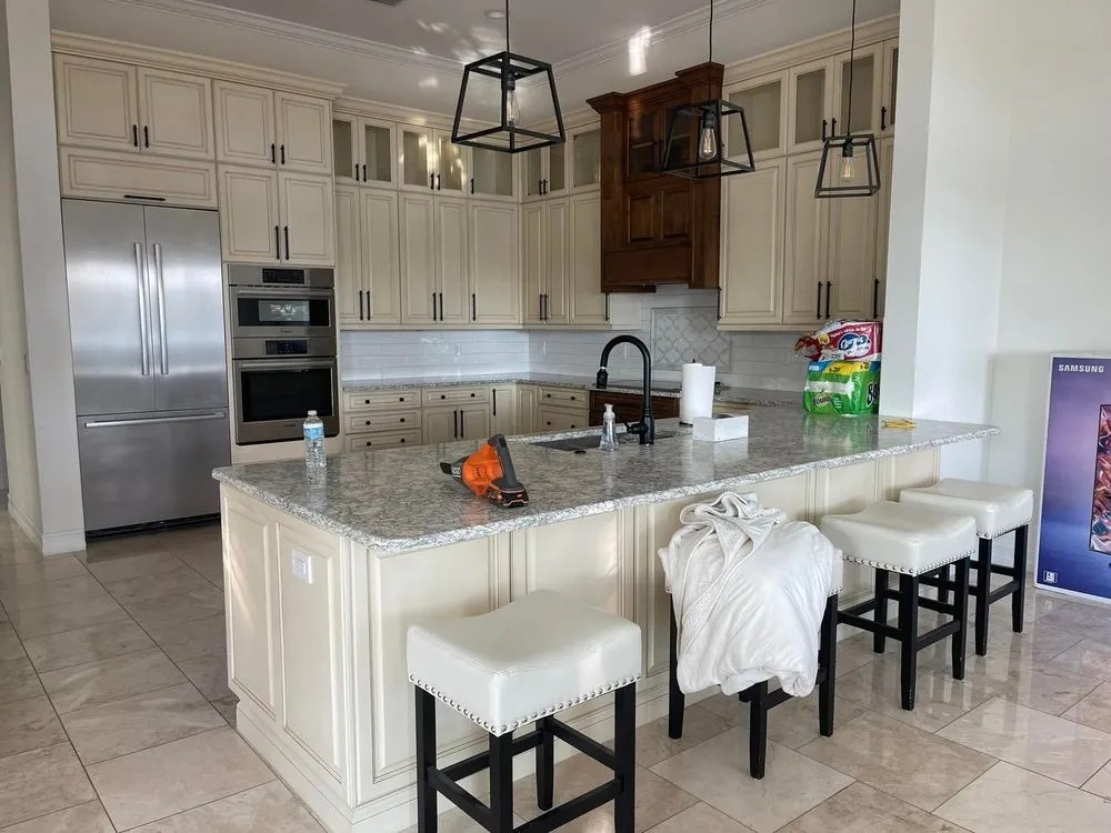 Kitchen with cream-painted cabinets and a large island