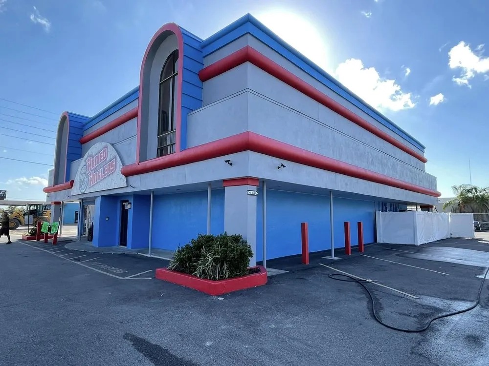Retro commercial building painted blue, white and red