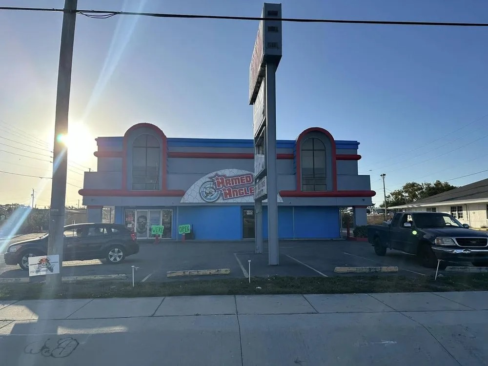 The blue, white and red commercial building at sunrise